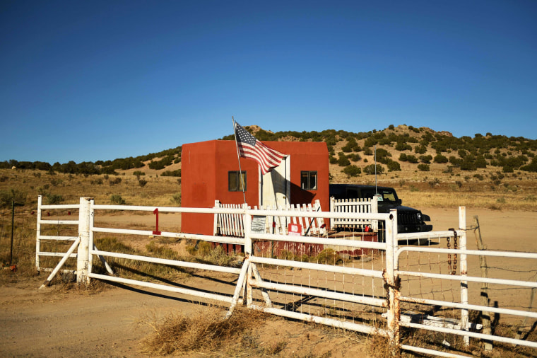 A U.S. flag flies at the entrance to the Bonanza Creek Ranch film set in Sante Fe, N.M., on Oct. 28, 2021.