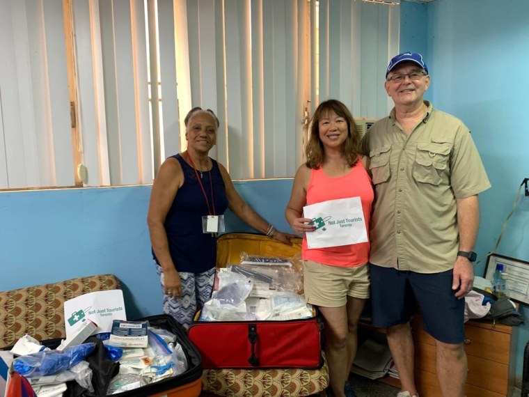 A vacationing couple brings a suitcase of medical supplies to a drop-off location in Cuba.