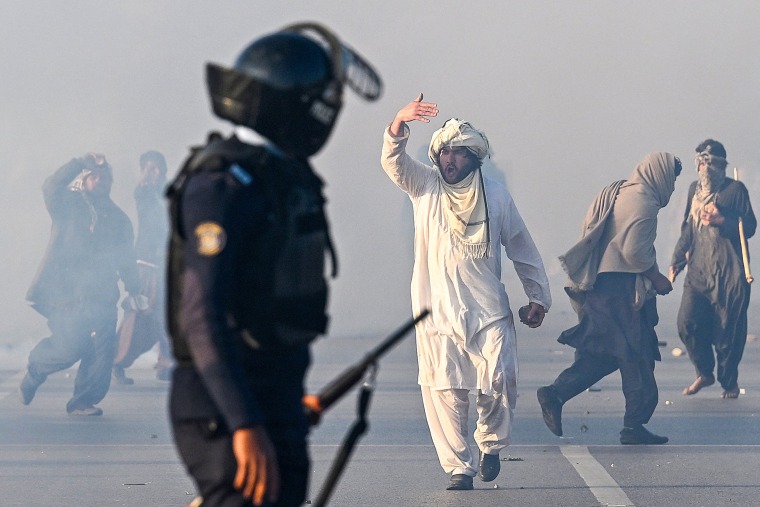 Thousands of protestors calling for the release of Pakistan's jailed ex-prime minister Imran Khan defied roadblocks and tear gas to march to the gates of the nation's capital on November 26. 