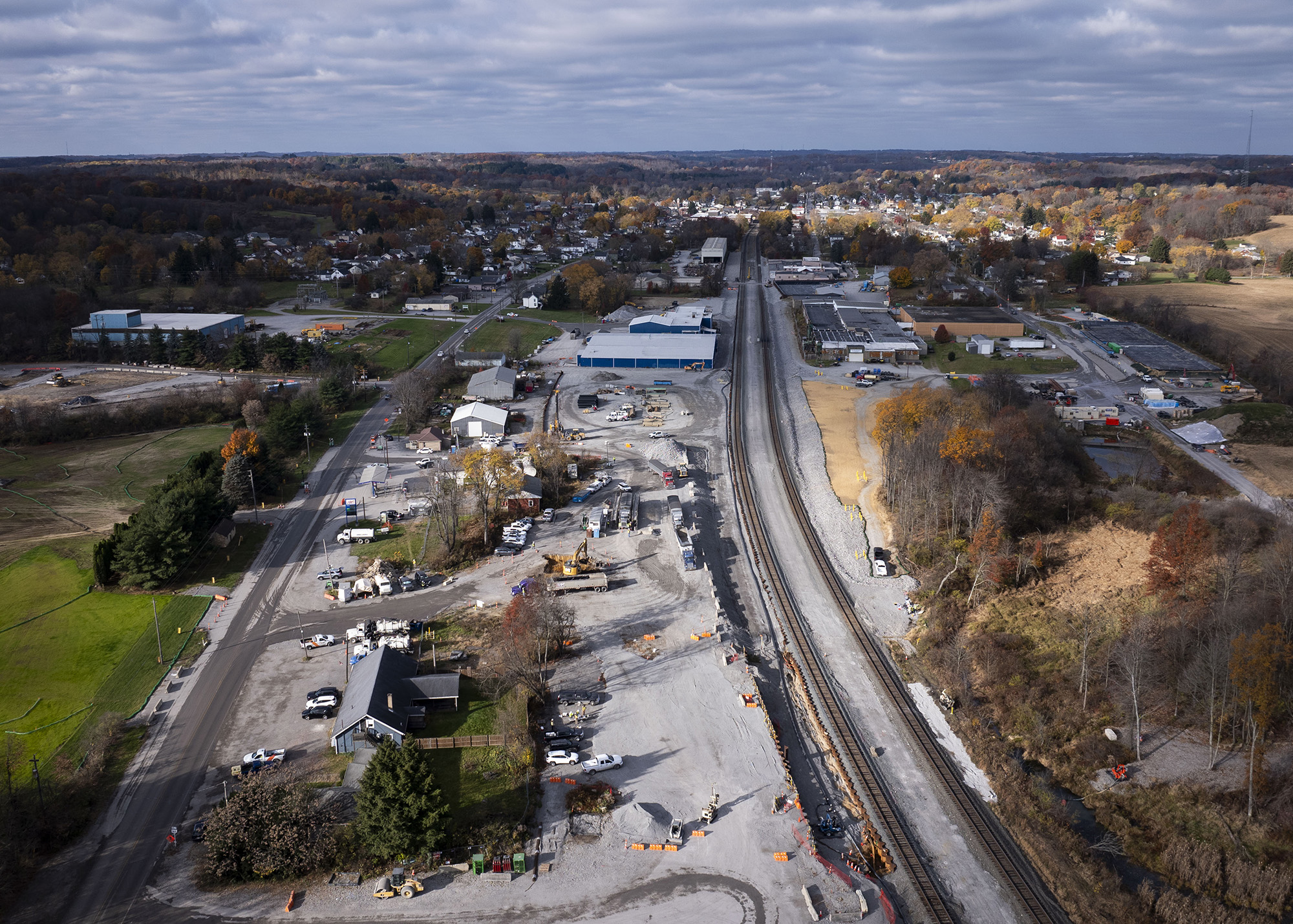 Aerial view of an industrial area with train tracks.