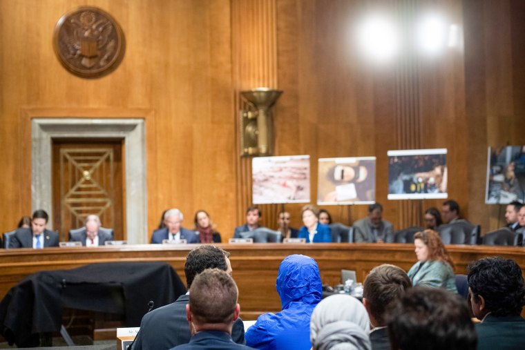 A person with a blue hoodie.