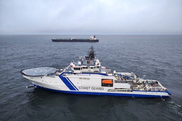 This handout picture released by The Finnish Border Guard on December 26, 2024 shows a Finnish Border Guard's ship Turva (front) and the oil tanker Eagle S on the sea near Porkkalanniemi. 