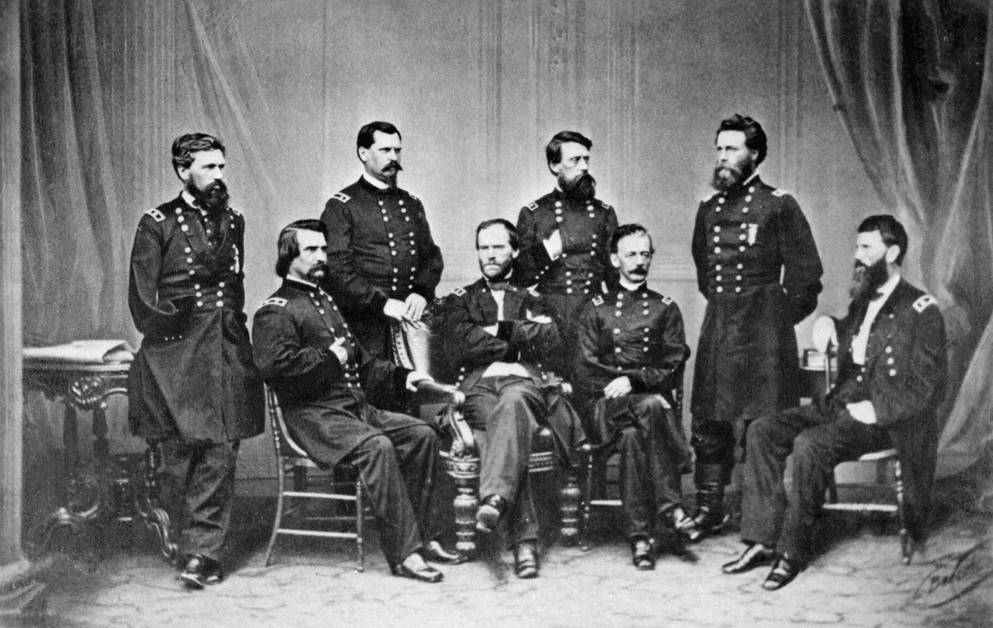 Black-and-white photo of Civil War officers sitting and standing in a group portrait.