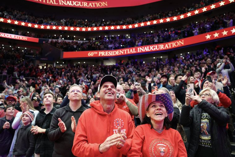 People watch the inauguration of U.S. President-elect Donald Trump from the Capital One Arena on January 20, 2025 in Washington.