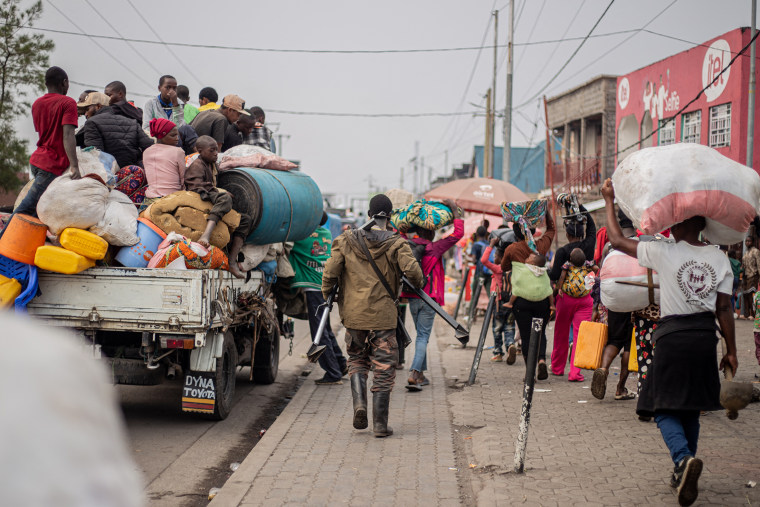 A Wazalendo (Patriots in Swahili) militiaman, part of a group of pro-government militias, retreats alongside residents as they flee from Kibati, where fighting has intensified, towards the city of Goma on Jan. 26, 2025. 