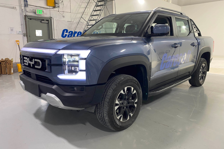 BYD Shark plug-in hybrid electric pickup truck in a garage