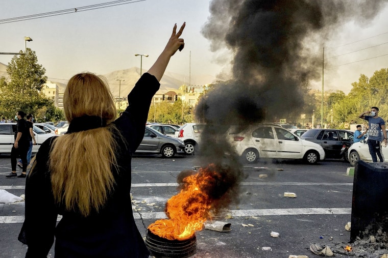 Iranians protests the death of 22-year-old Mahsa Amini after she was detained by the morality police, in Tehran, Oct. 1, 2022.