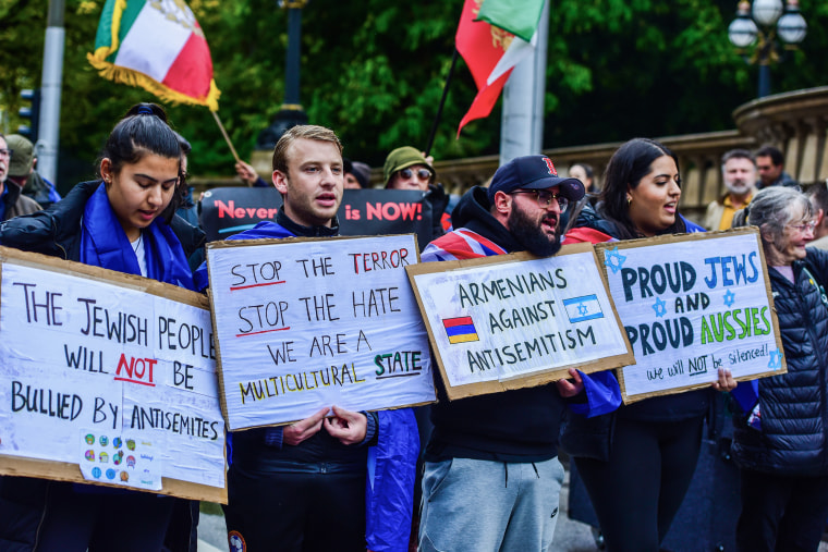 Pro-Jewish supporters hold placards during the Pro-Jewish