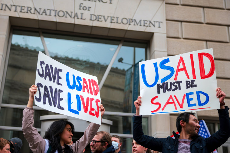 Protestors outside the USAID headquarters.