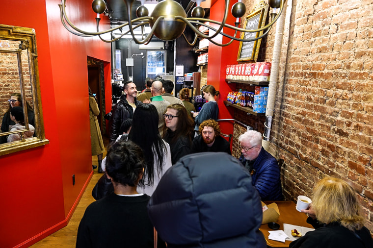 Customers line up inside the brick and motar Mary O's shop for scones and loafs of Irish soda bread.