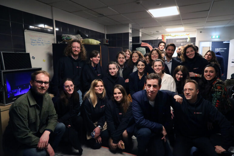 Members of the cast and Forbidden Stories staff backstage at the Theater