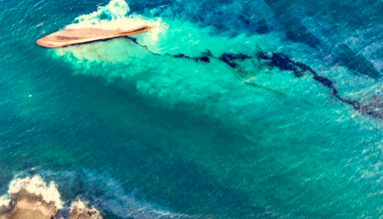 An image of a capsized vessel – later identified as a towed barge – and the start of its 10 kilometer-long oil slick off the coast of Tobago. Bellingcat tapped ship enthusiasts' knowledge to eventually identify the boat's name and origin. Image: Screenshot, Office of the Chief Secretary of Tobago